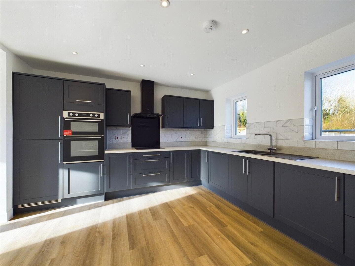 A finished Rydon Village kitchen with Caple cabinetry and integrated appliances